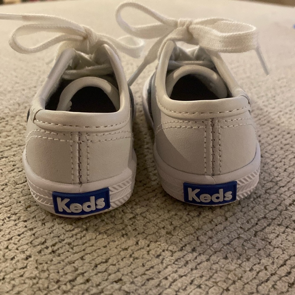 NWOT - Never worn! 4.5 toddler white leather lace up Keds.